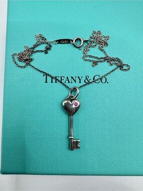 Tiffany & Co. Silver Heart Key Necklace with Pink Sapphire